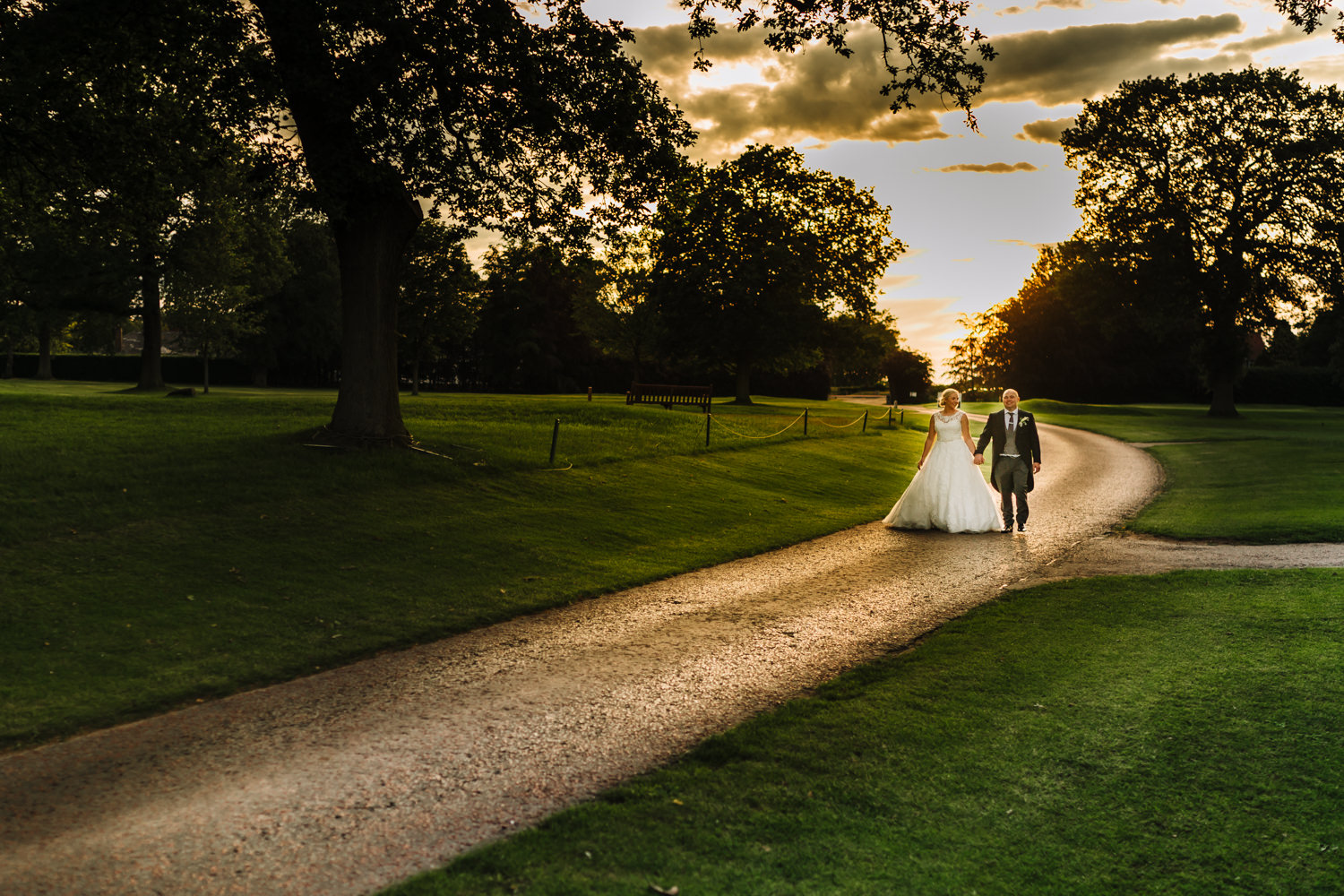 Bride and groom walking in the sun