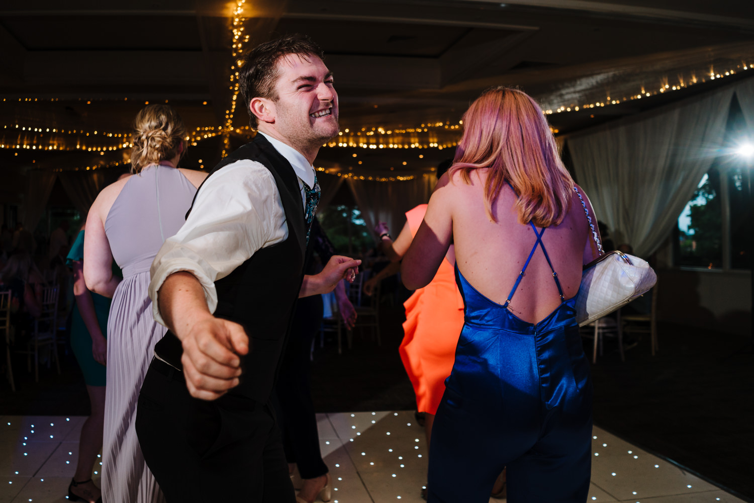 Wedding guests dancing