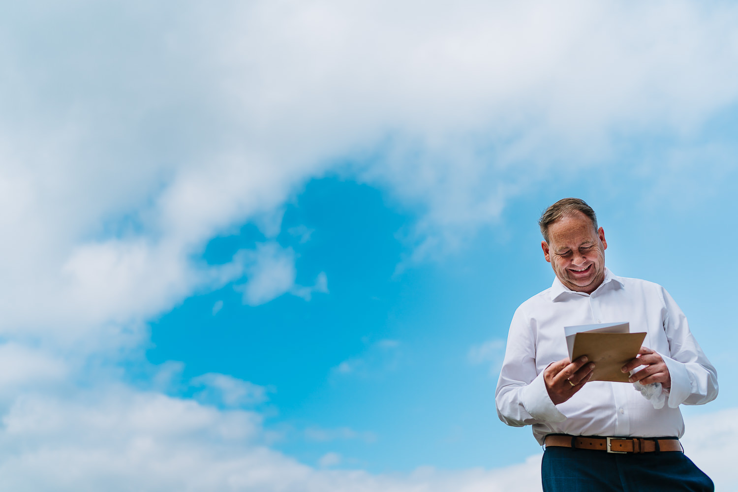 Dad reading his card from his daughter