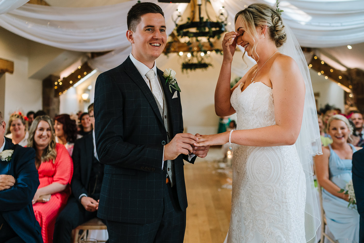 bride and groom laughing during the vows