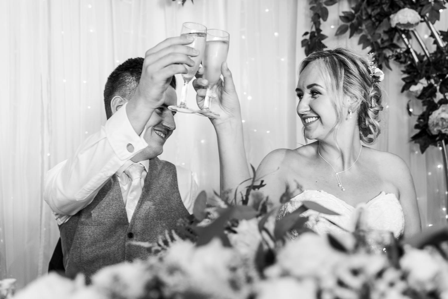 bride and groom toasting