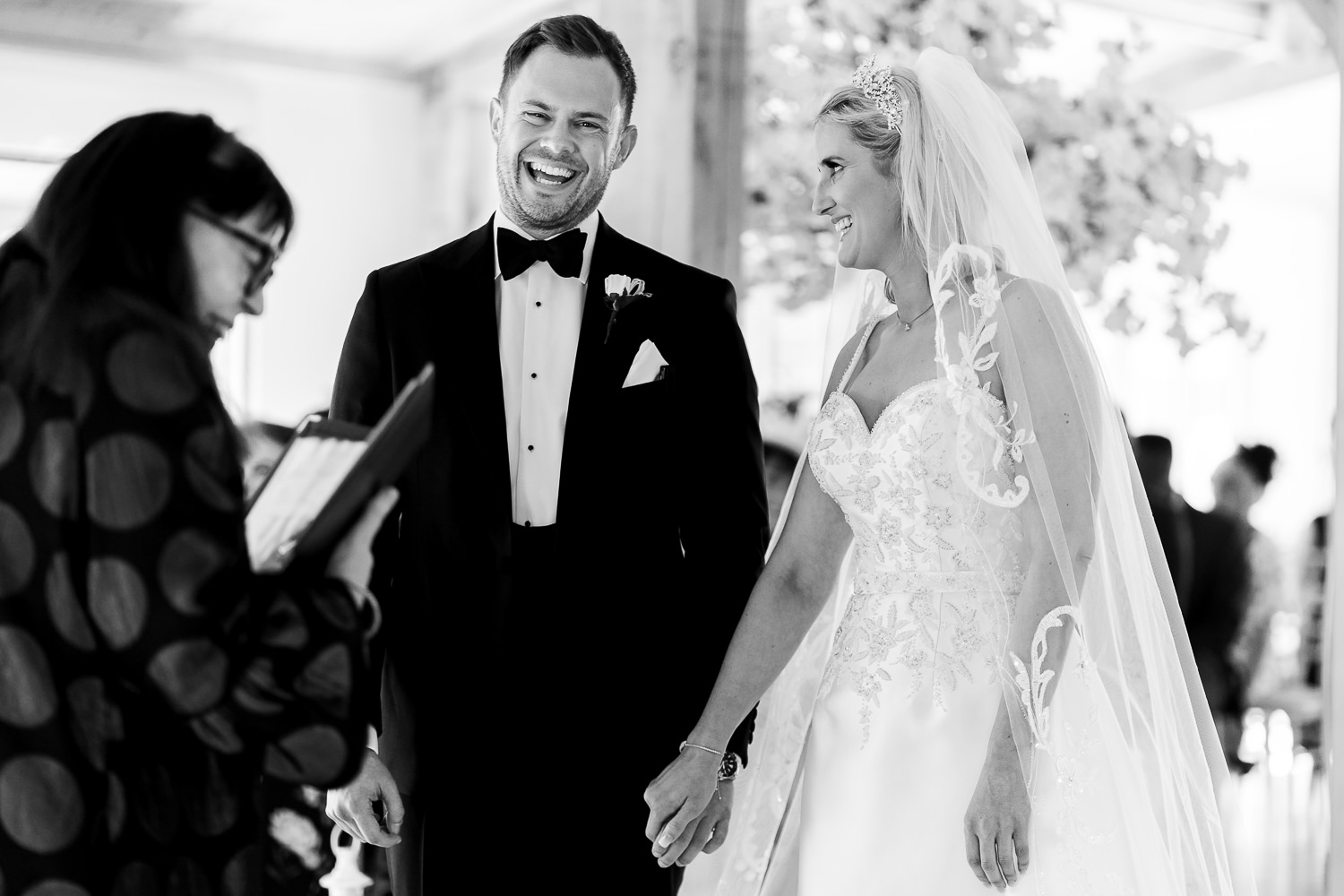 Bride and groom laughing during ceremony