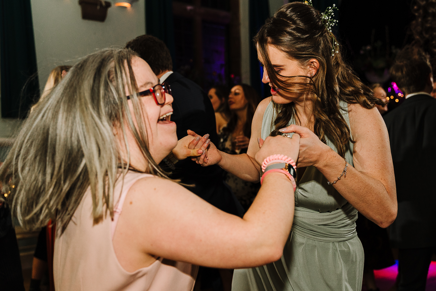 Wedding guest dancing with bridesmaid