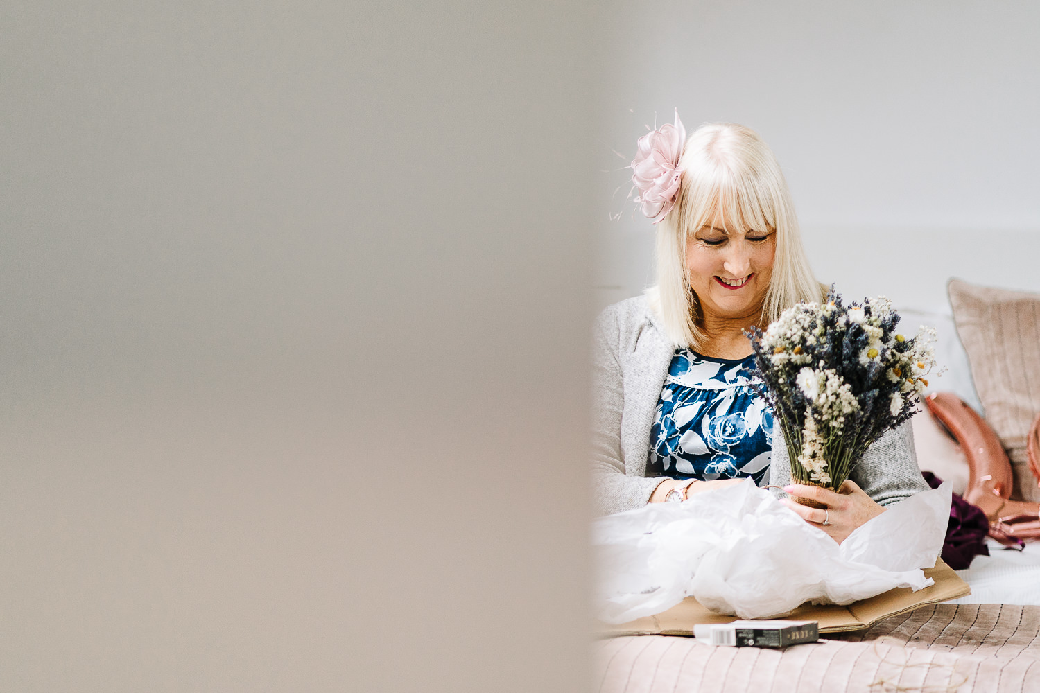 mother of the bride looking at the flowers