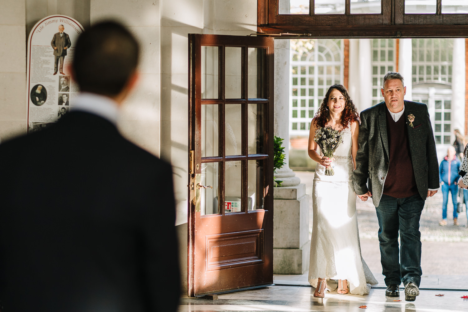 Bride walking down the aisle at Ashton Memorial