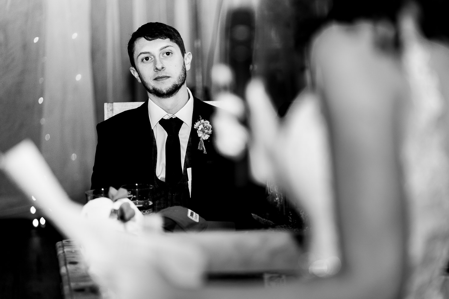 Groom looking on to Brides speech