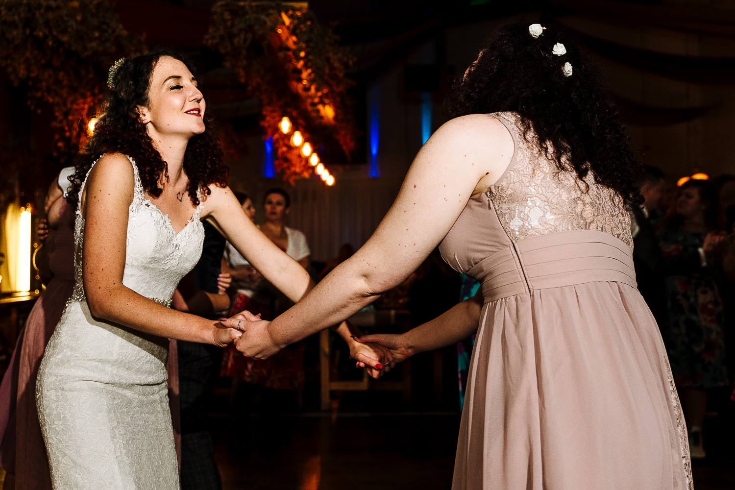 Bride dancing with her sister