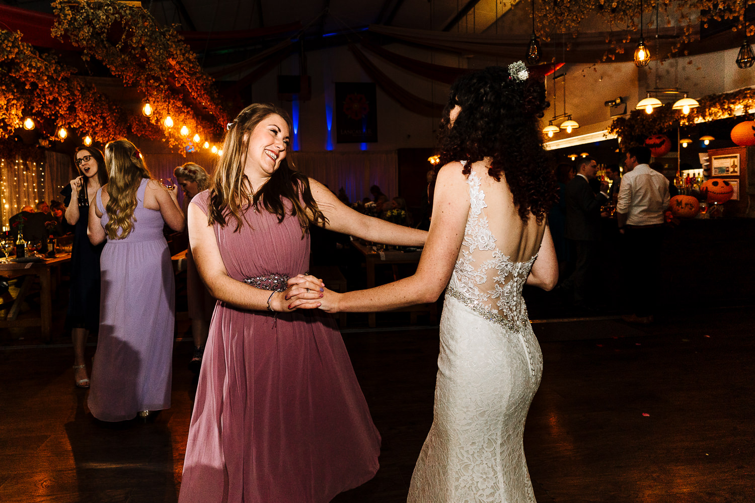 Bride dancing with bridesmaid