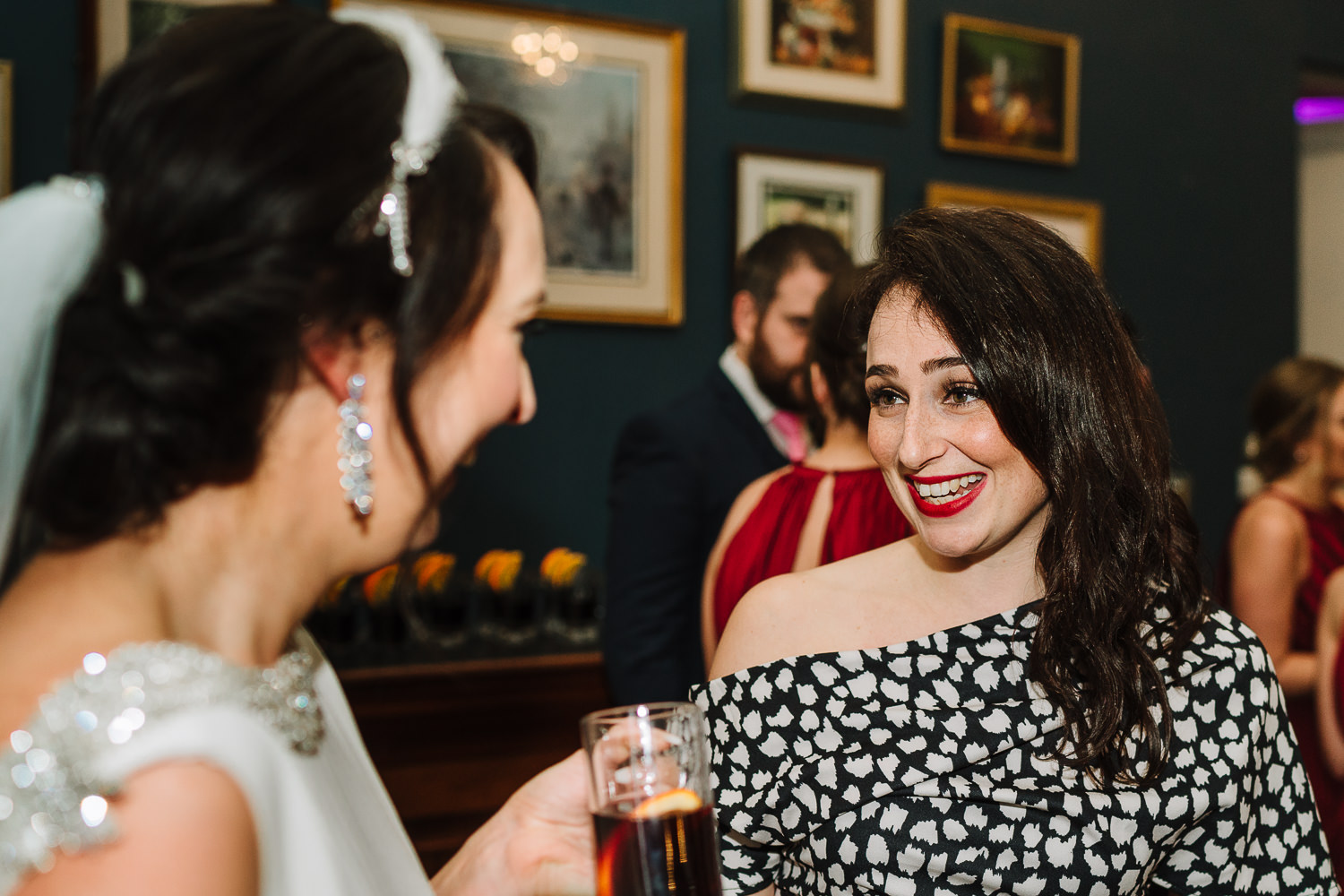Bride smiling with a guest
