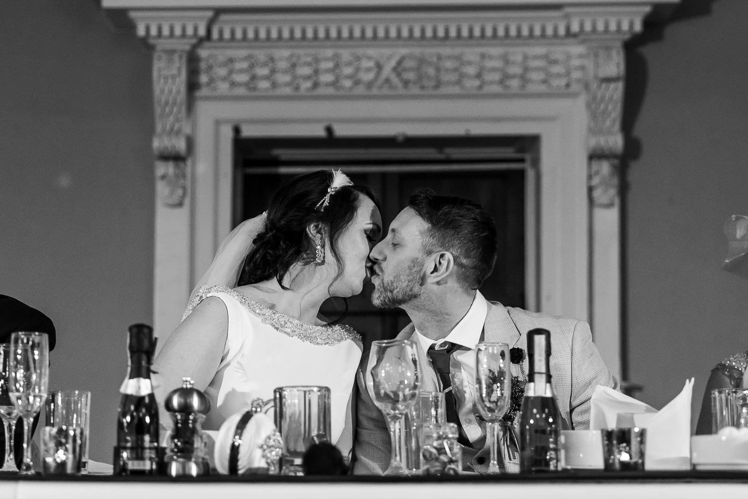 bride and groom kissing after speeches