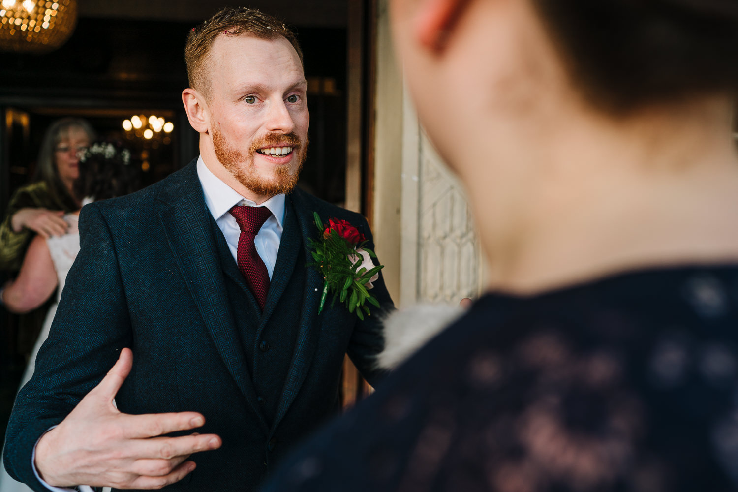 Groom talking to guests