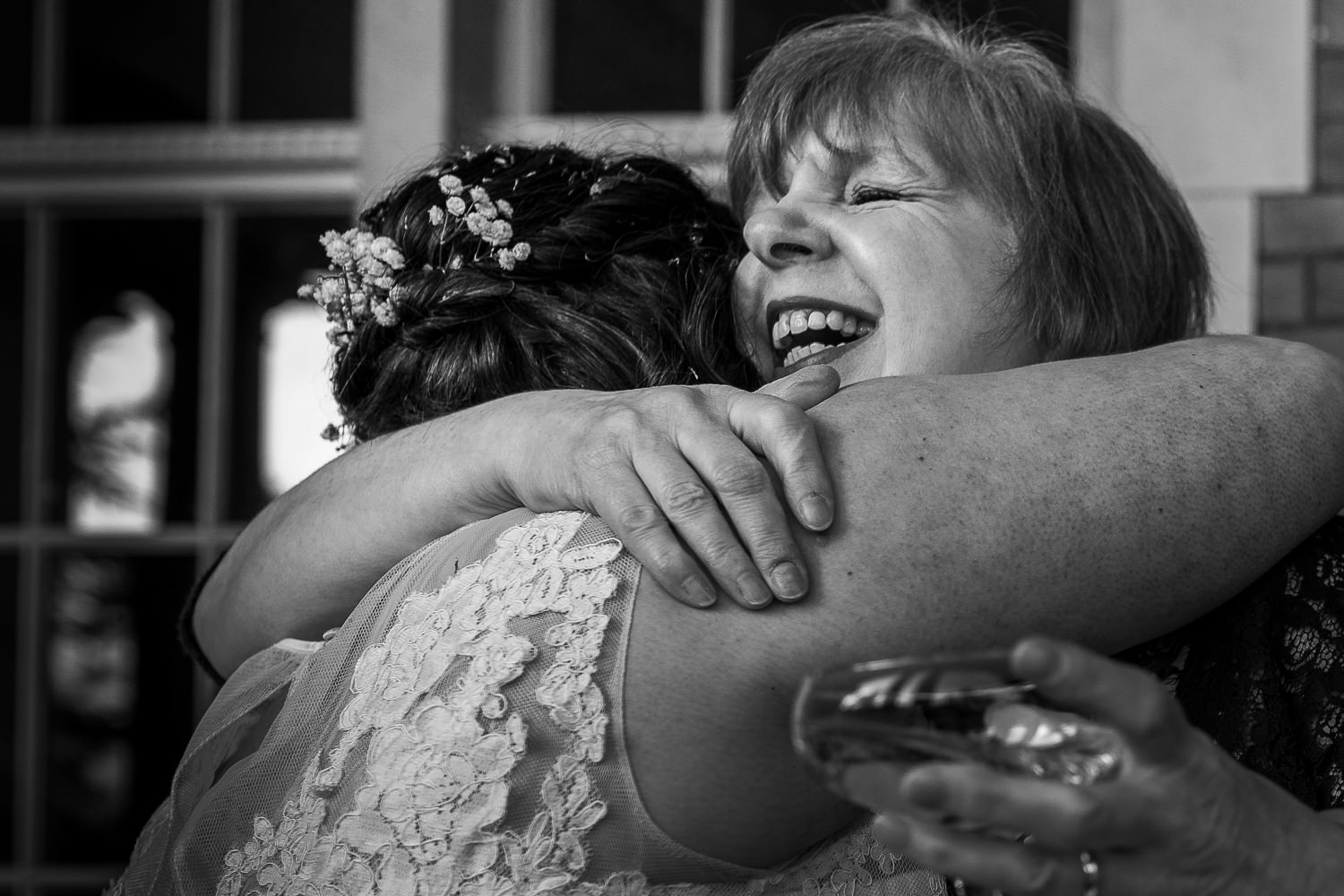 Bride hugging a female guest