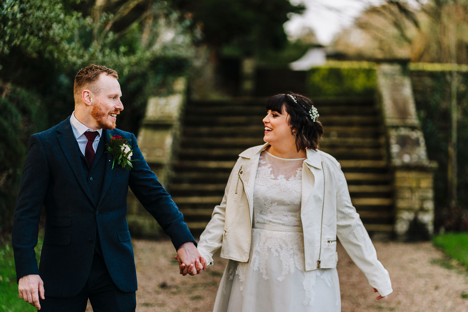 Bride and groom walking at Eaves Hall