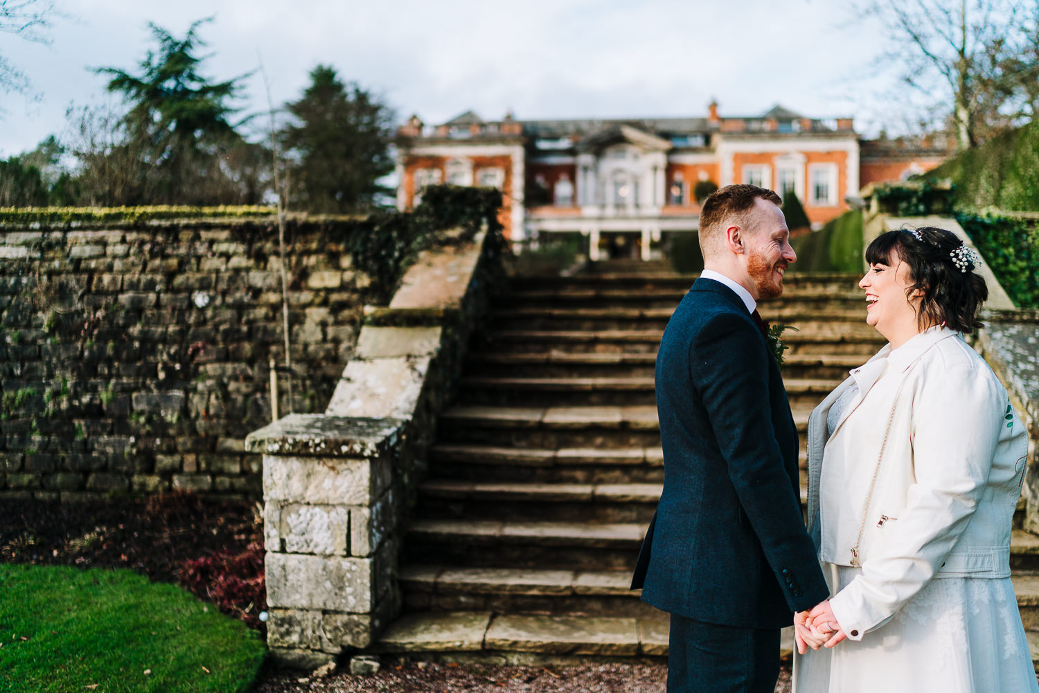 Bride and groom cuddling at Eaves Hall