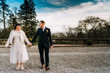 Bride and groom walking at Eaves Hall