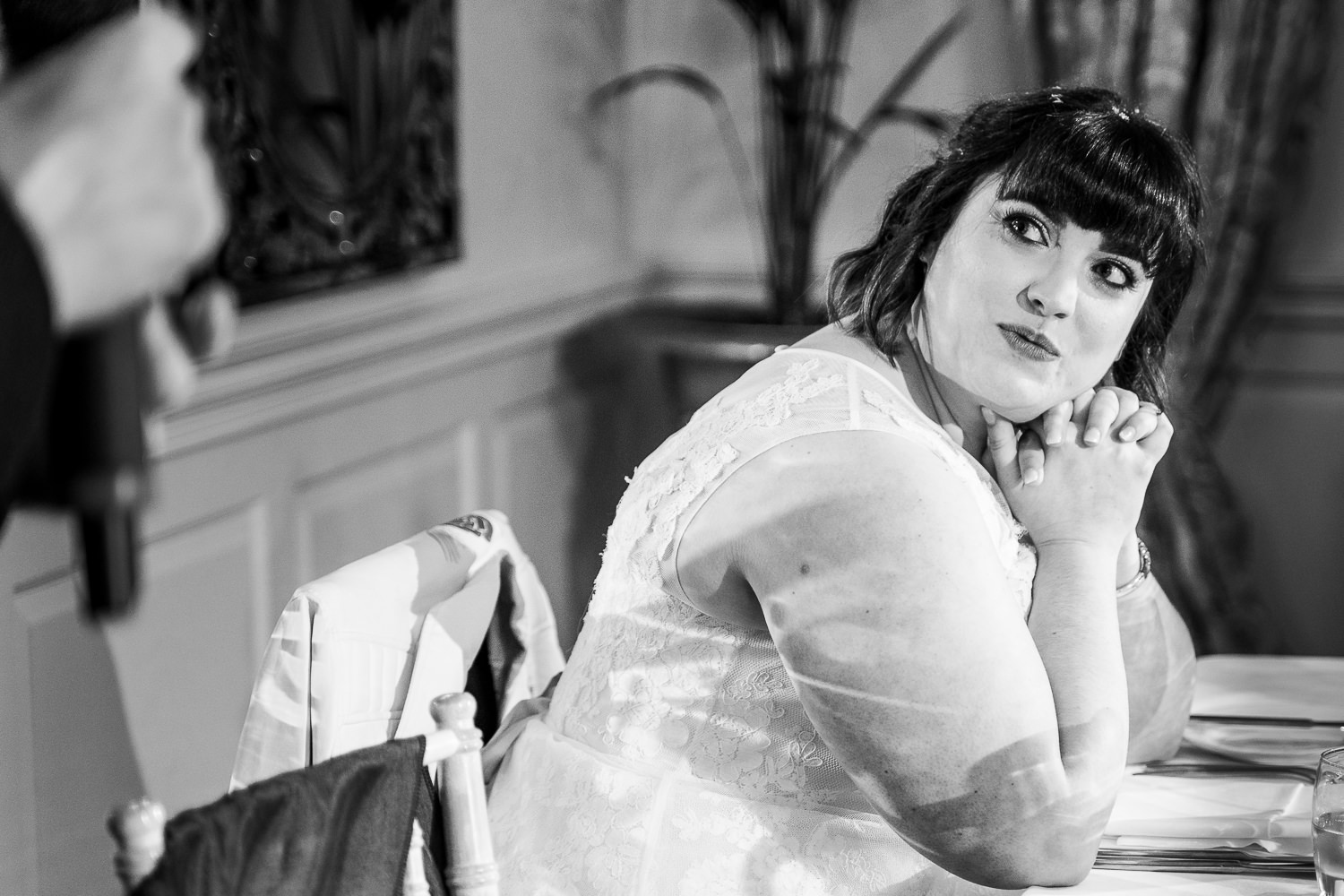 Bride looking on to groom