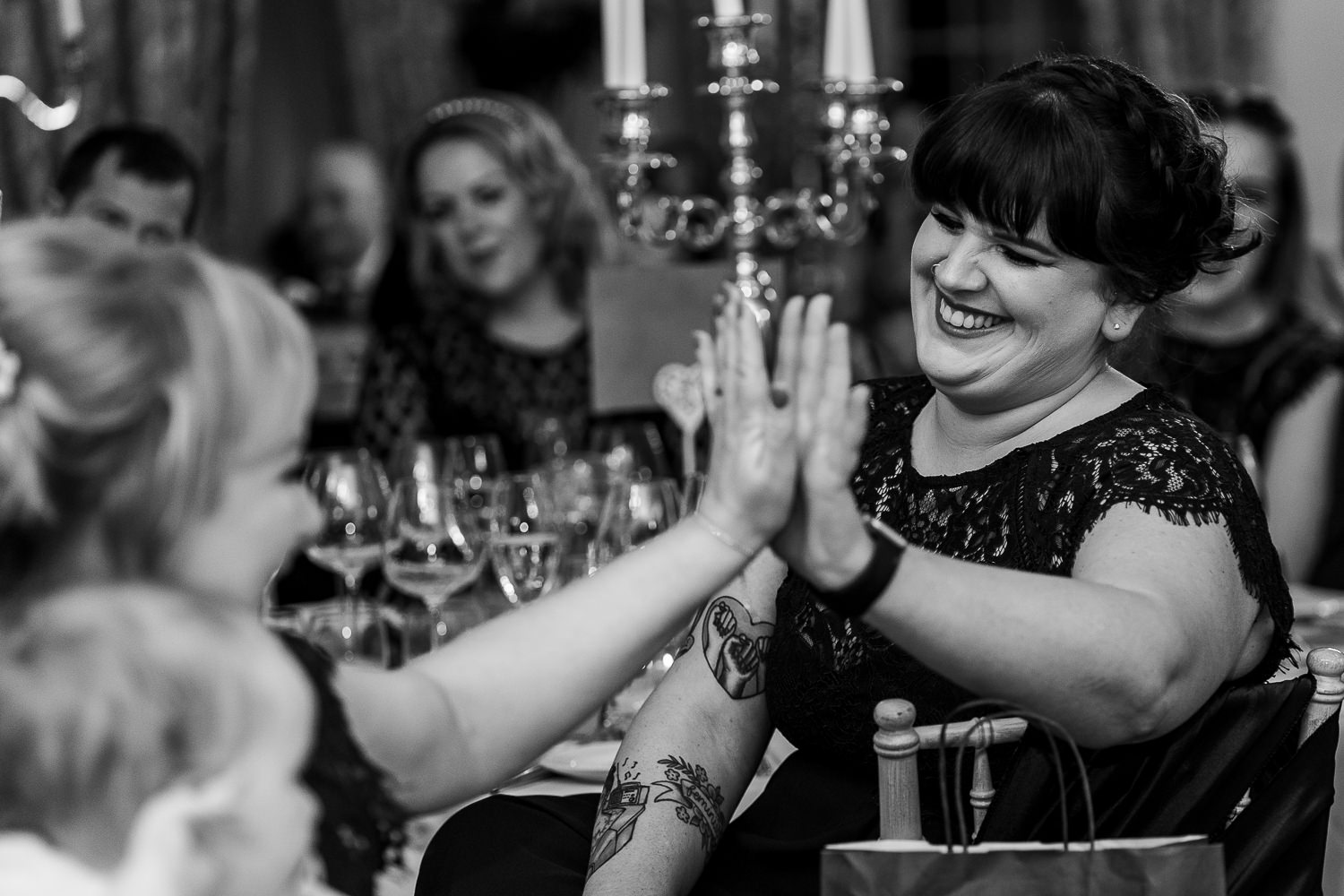 Female guests laughing and high giving