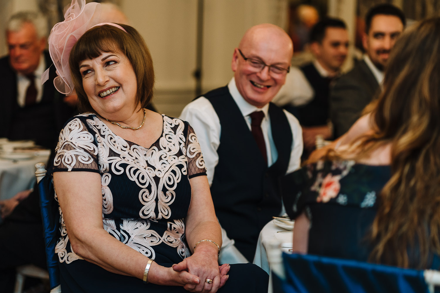 Parents of the groom laughing