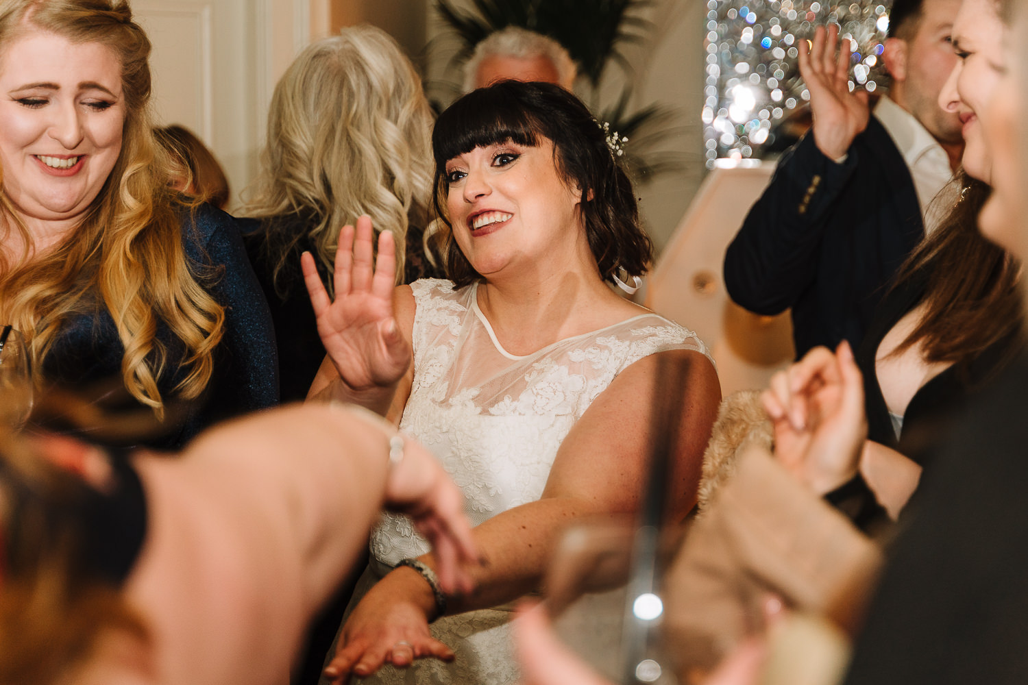 Bride dancing on Eaves Hall