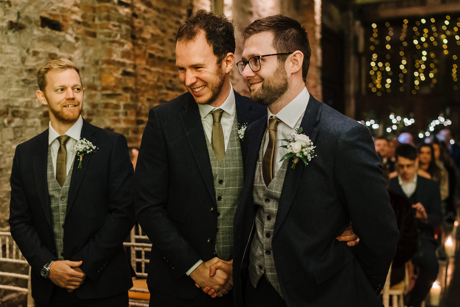 Groom shaking hands with best man