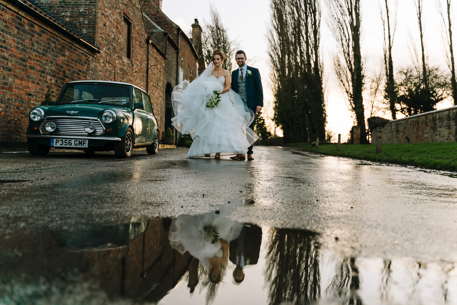 bride and groom walking back to the venue