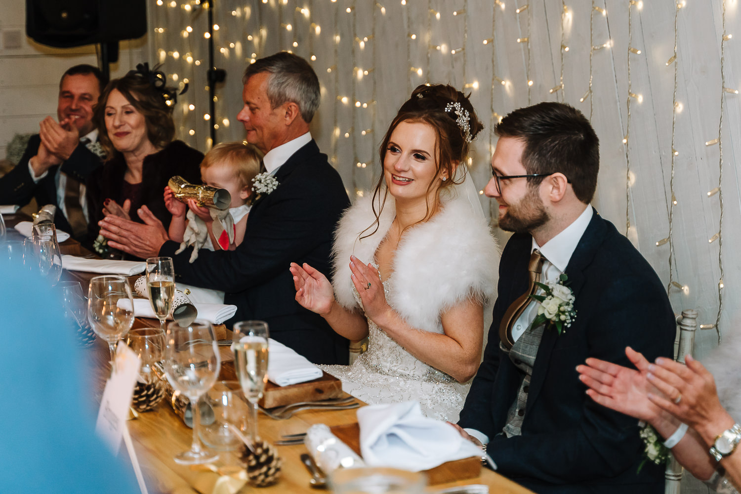 bride clapping the best man