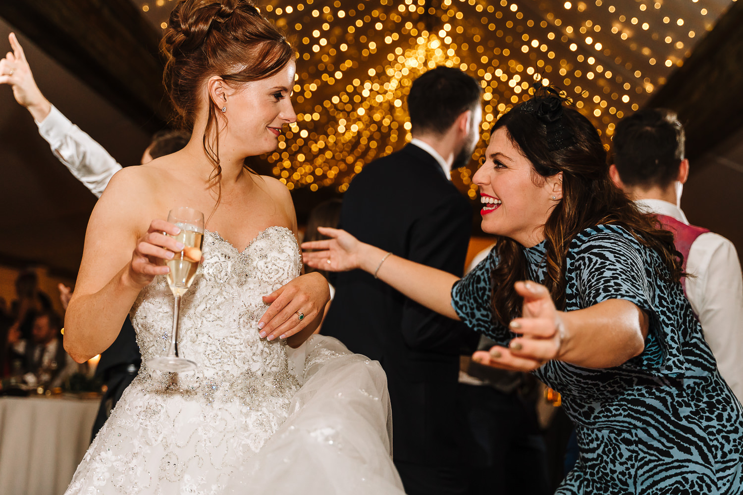 Female guest and the bride dancing