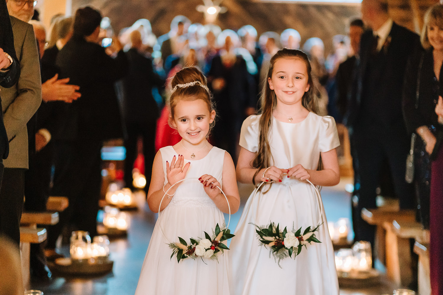 Flower girls walking down the aisle