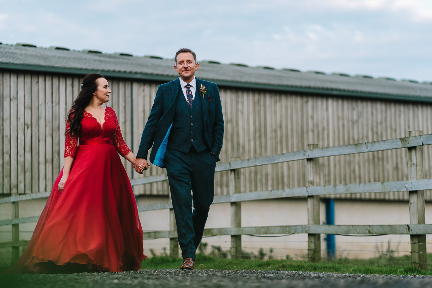 Bride and groom walking at Owen House barn
