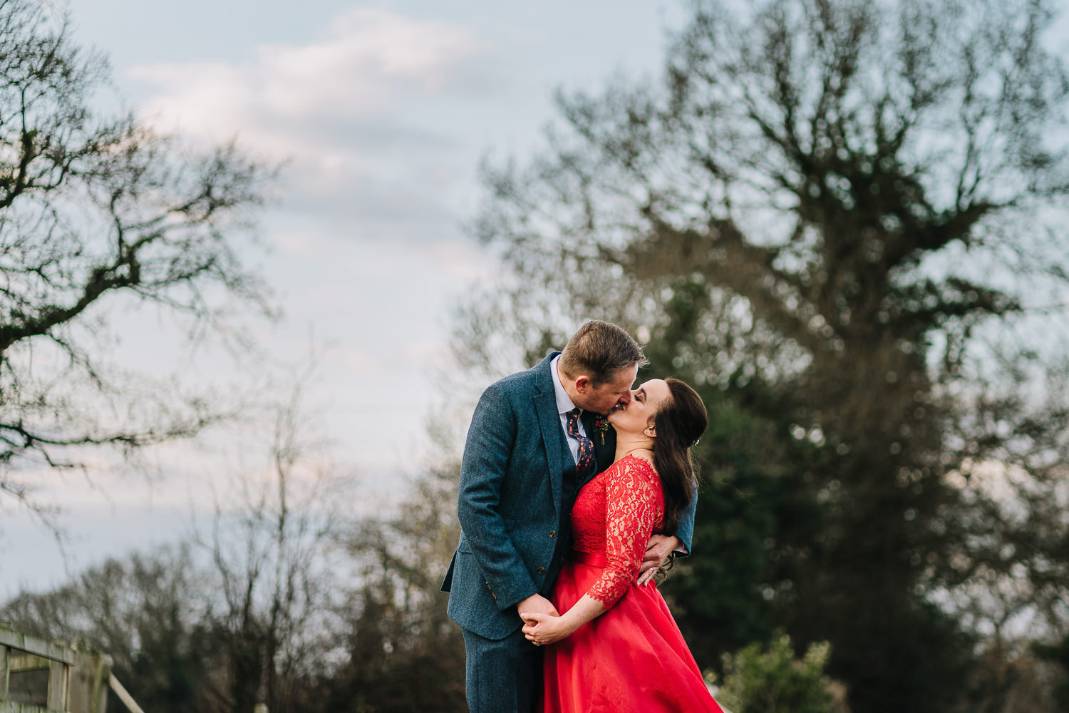 Bride and groom kissing at Owen House