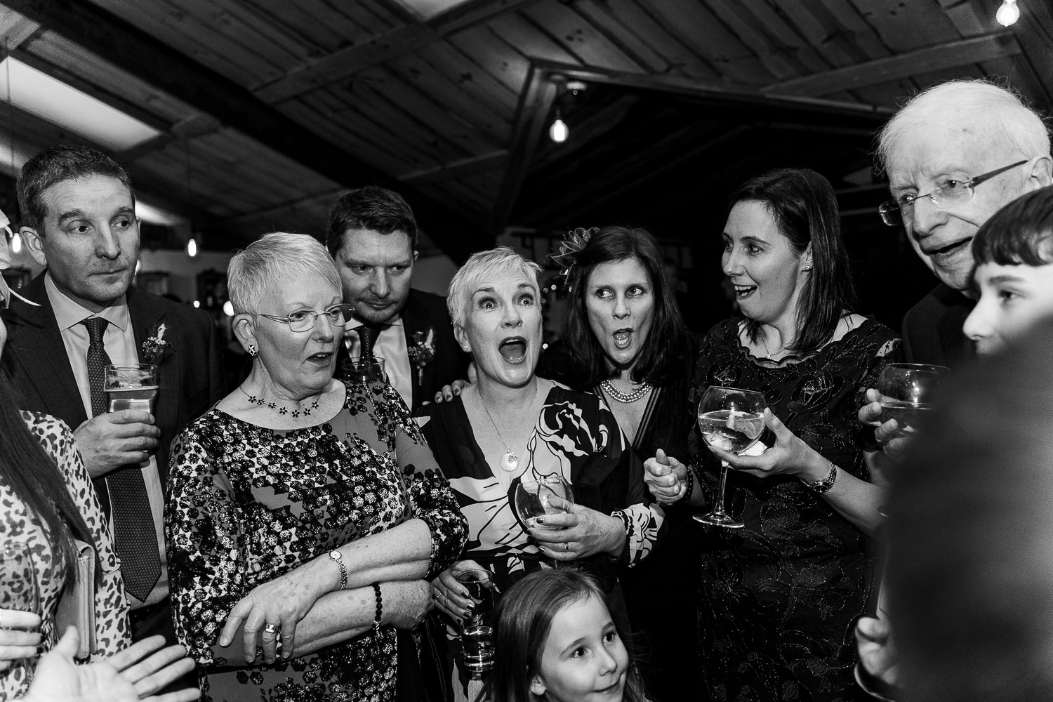 Guests laughing with magician