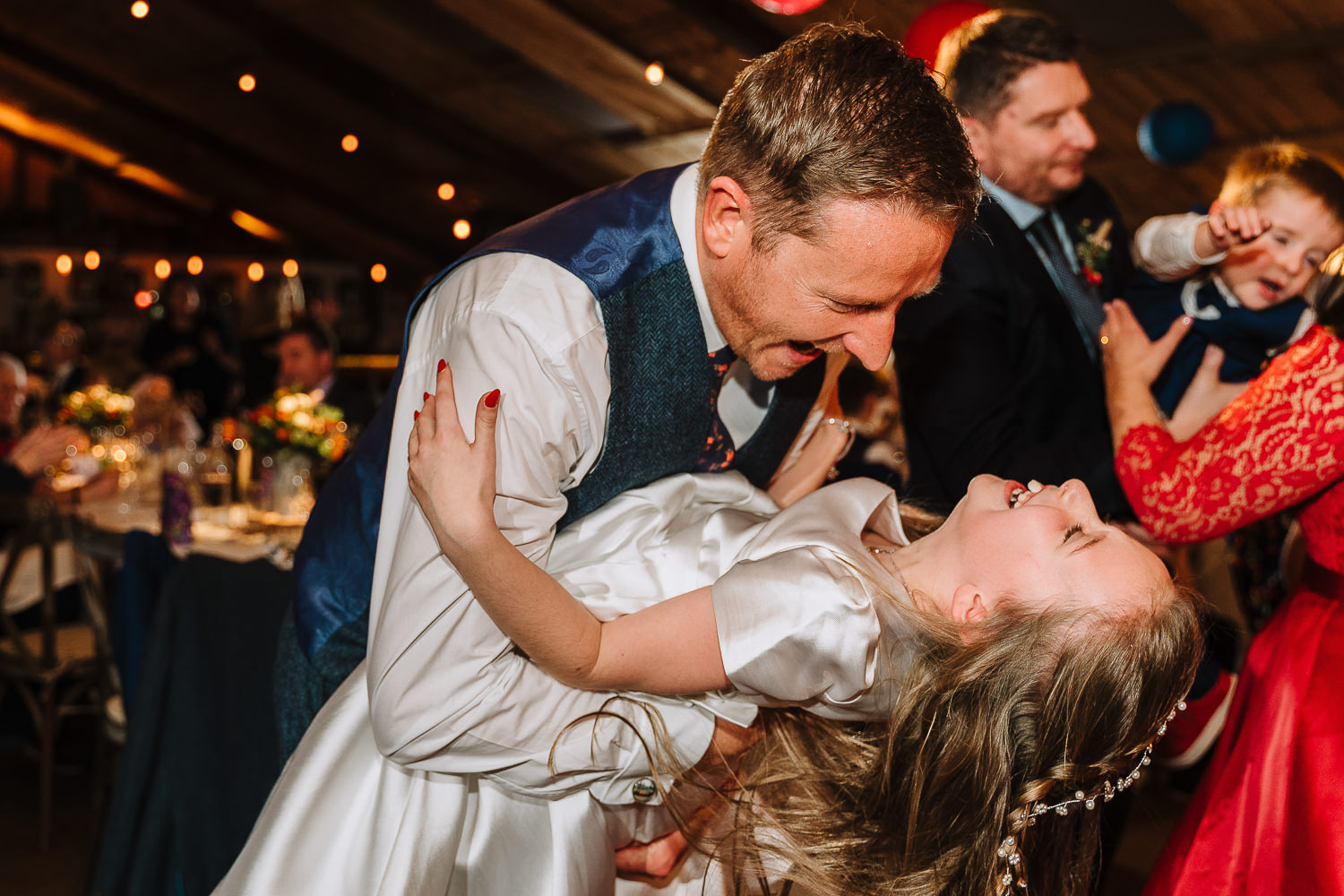 Groom dancing with his daughter