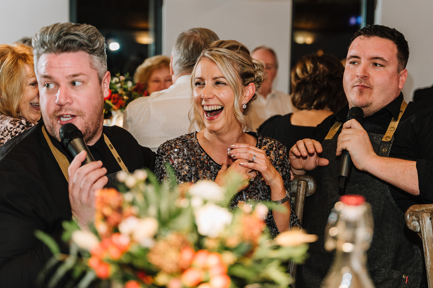 Guest laughing with the two singing waiters