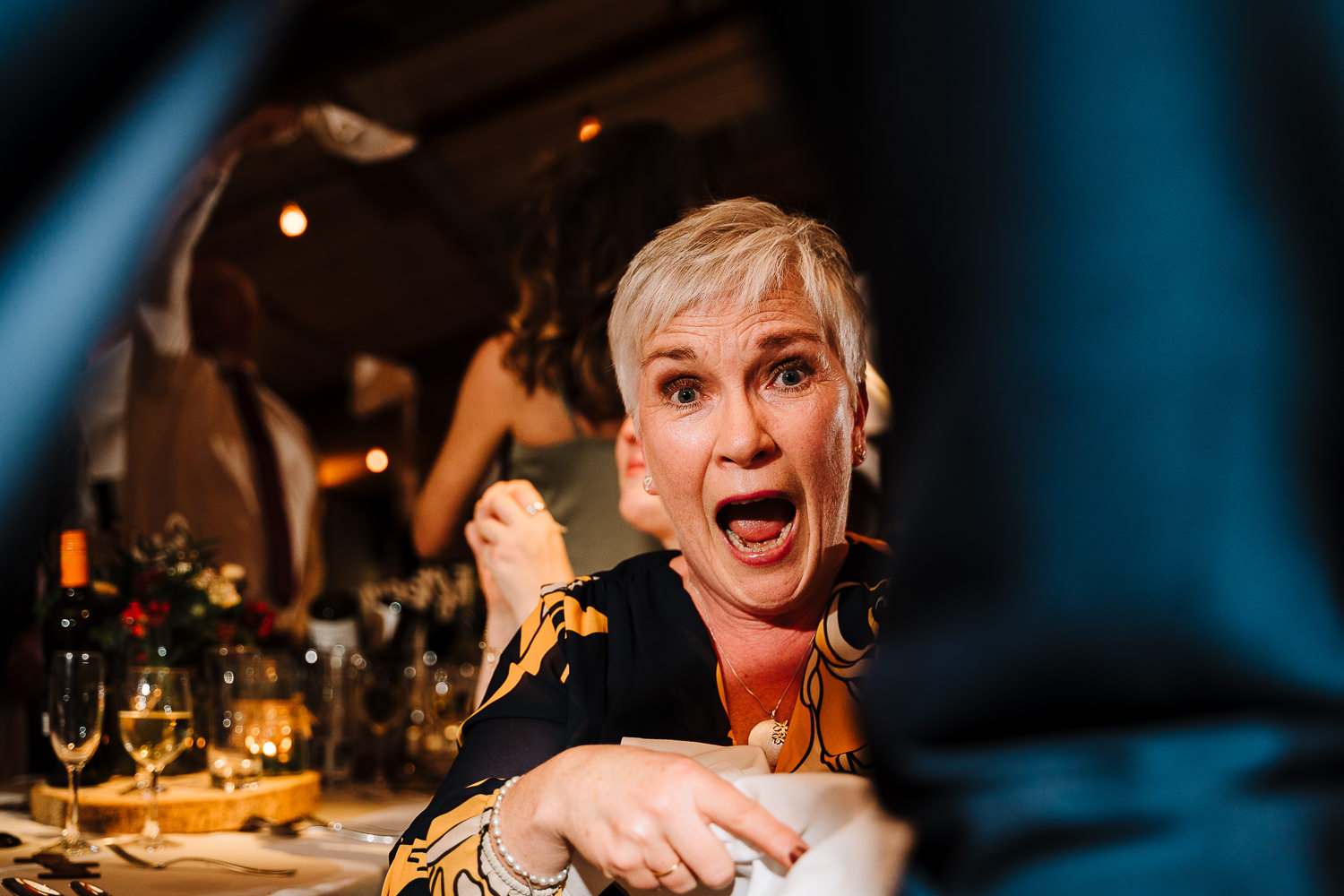 guest smiling between someones legs