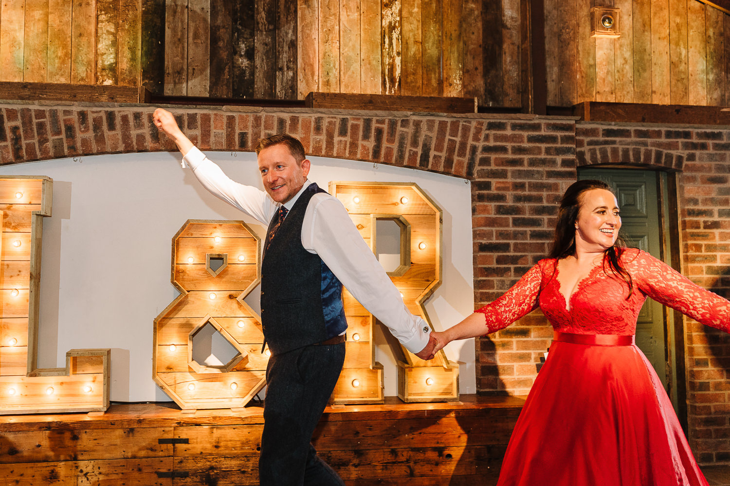 Bride and groom doing the conga