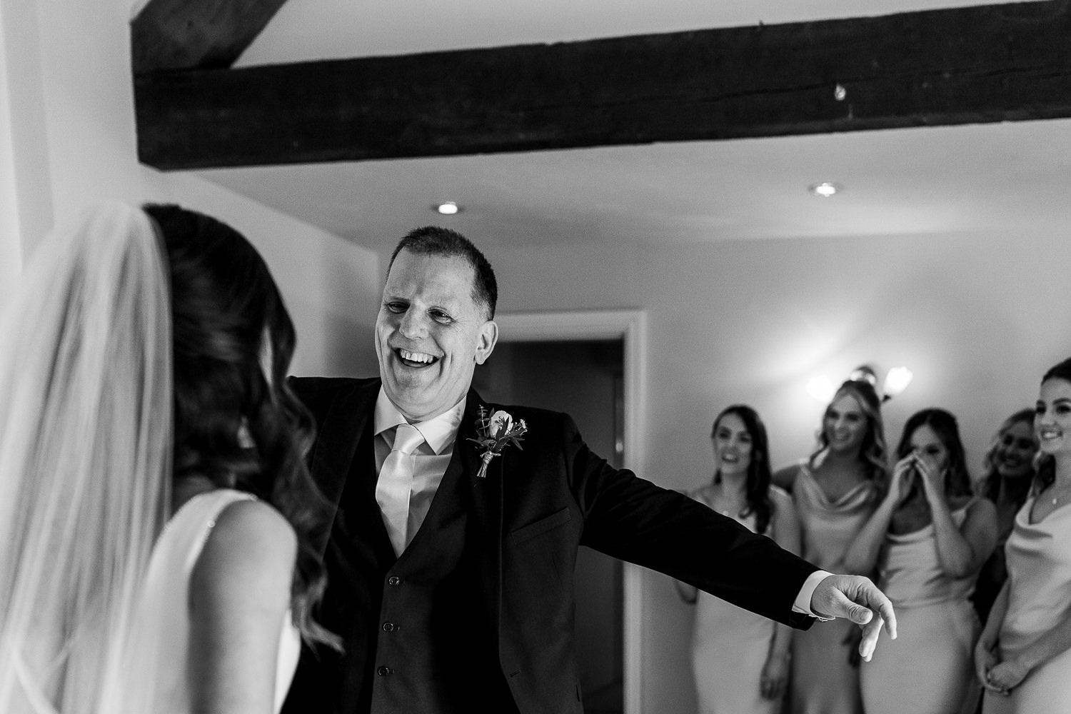 Sandhole Oak Barn Wedding Photography 18 dad hugging the bride at Sandhole Oak Barn