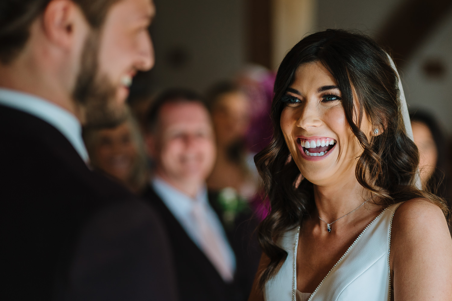 Sandhole Oak Barn Wedding Photography 37 Bride laughing during the vows