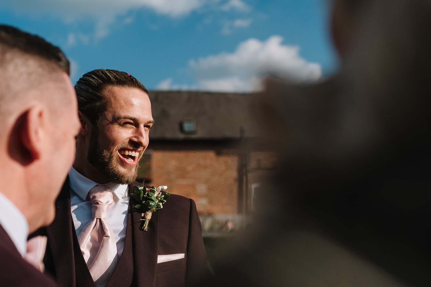 Sandhole Oak Barn Wedding Photography 41 Groom greeting guests outside