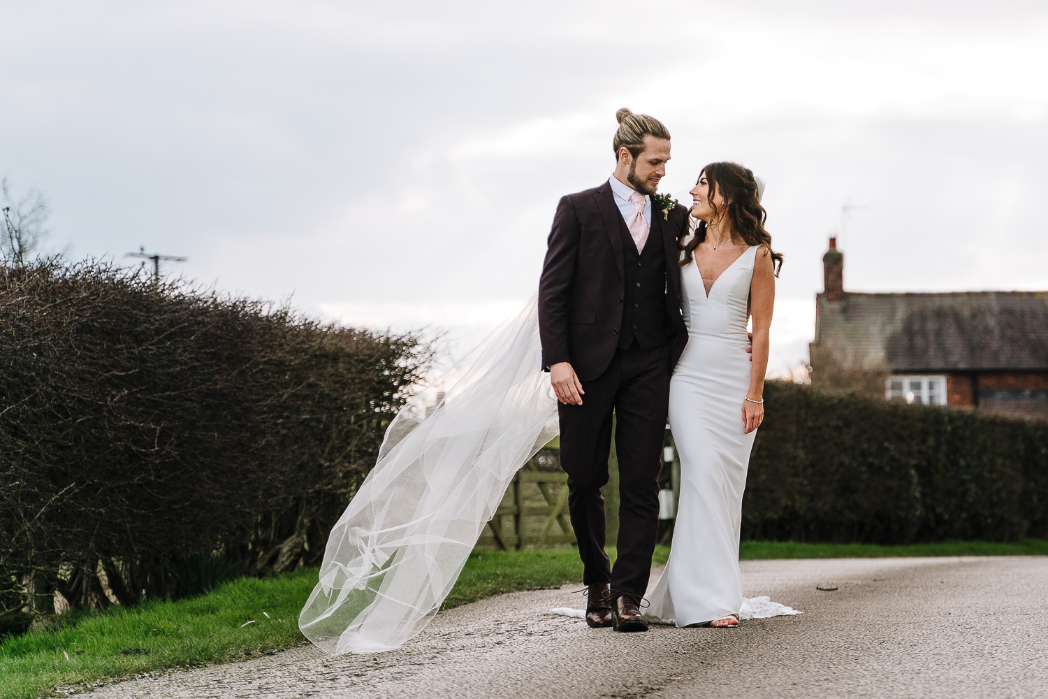 Sandhole Oak Barn Wedding Photography 52 bride and groom walking down the drive at Sandhole oak Barn