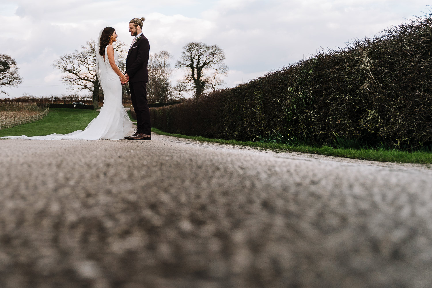 Sandhole Oak Barn Wedding Photography 55 photo of the bride and groom on the drive