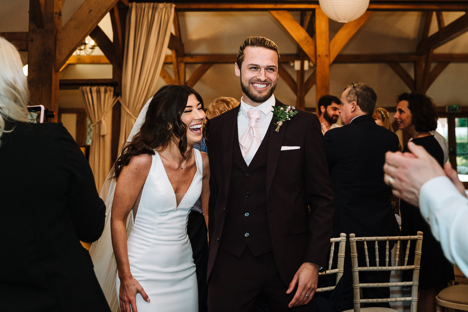 Sandhole Oak Barn Wedding Photography 60 Bride and groom walking into the room for speeches