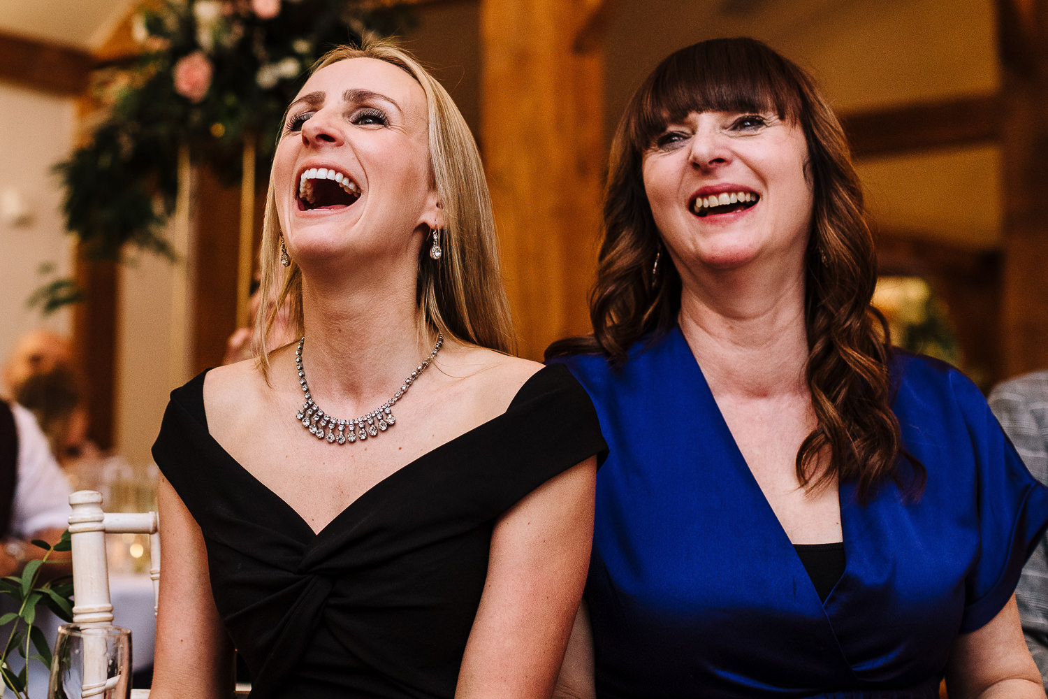 Sandhole Oak Barn Wedding Photography 66 guests laughing at the speeches