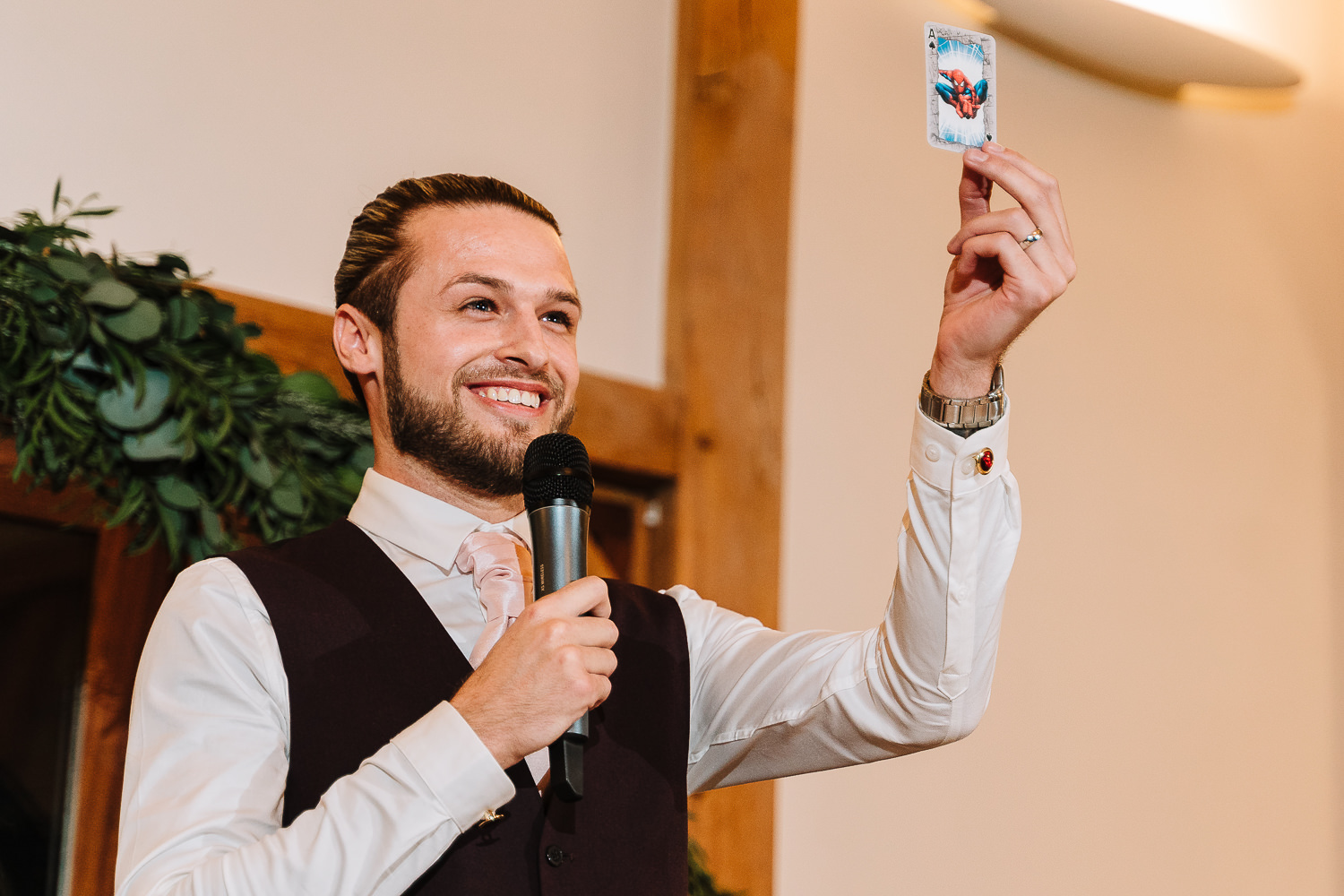 Sandhole Oak Barn Wedding Photography 73 Groom holding up a prop at Sandhole Oak Barn