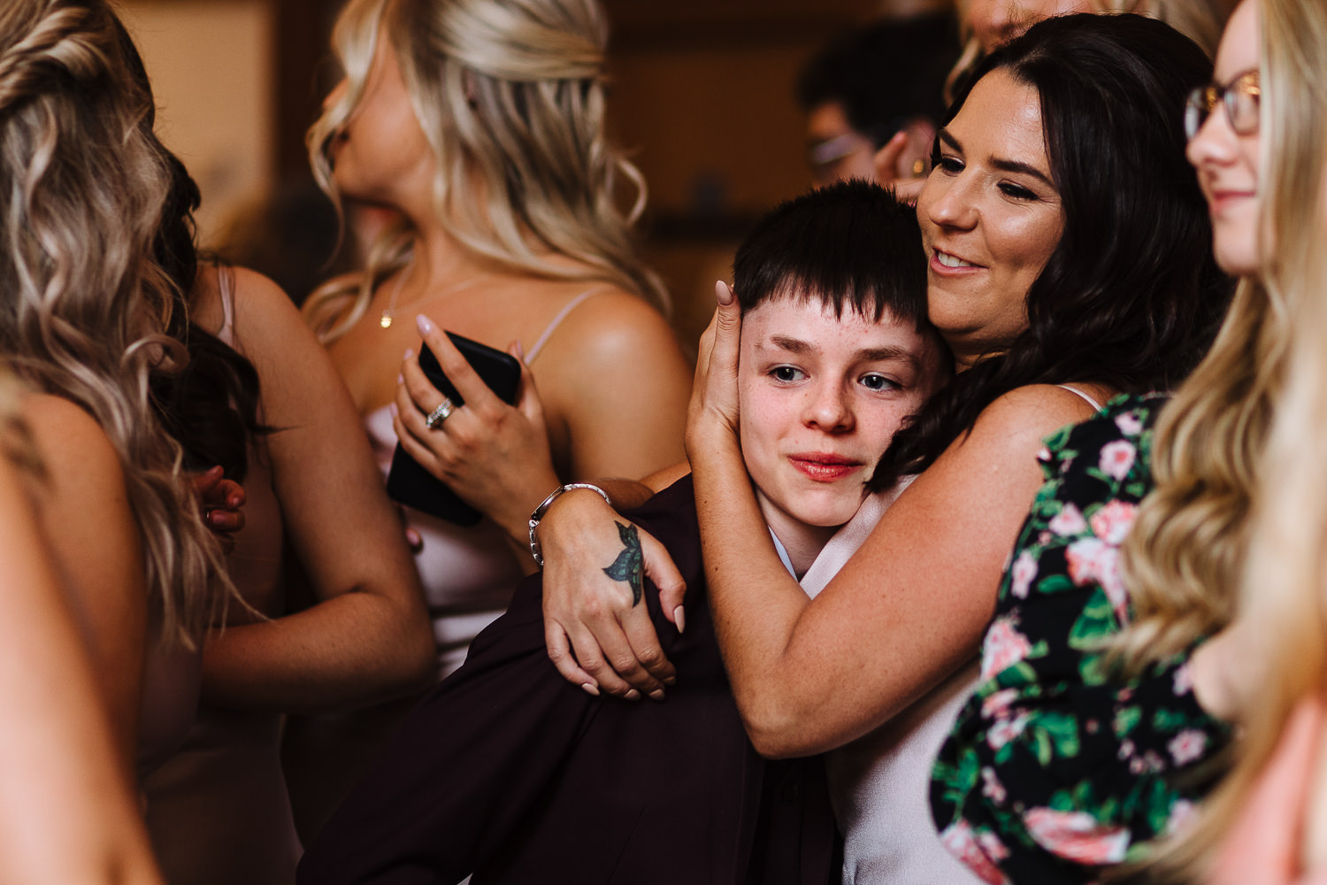 Sandhole Oak Barn Wedding Photography 82 Maid of honour holding her son during speeches
