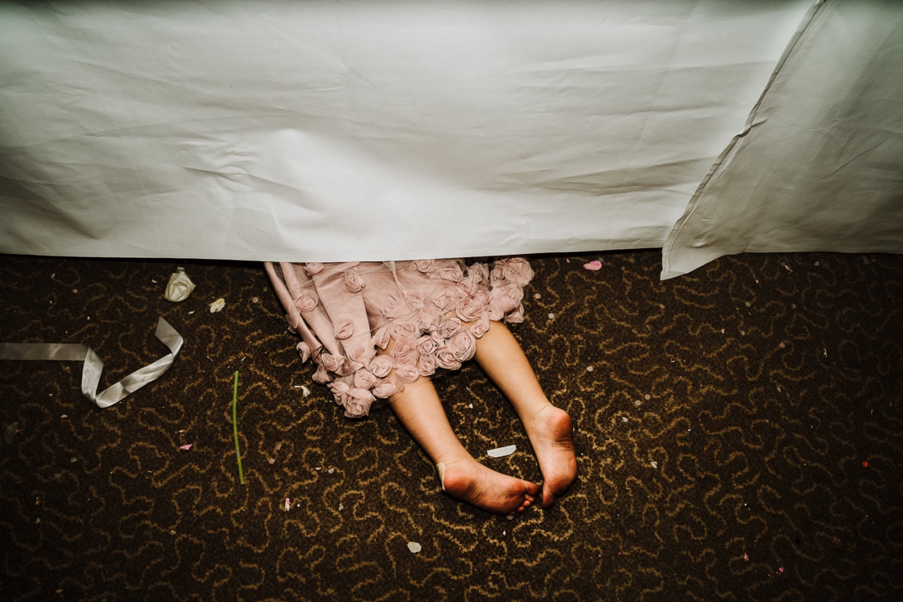Top Tips For Children At Your Wedding 3 flower girl hiding under table