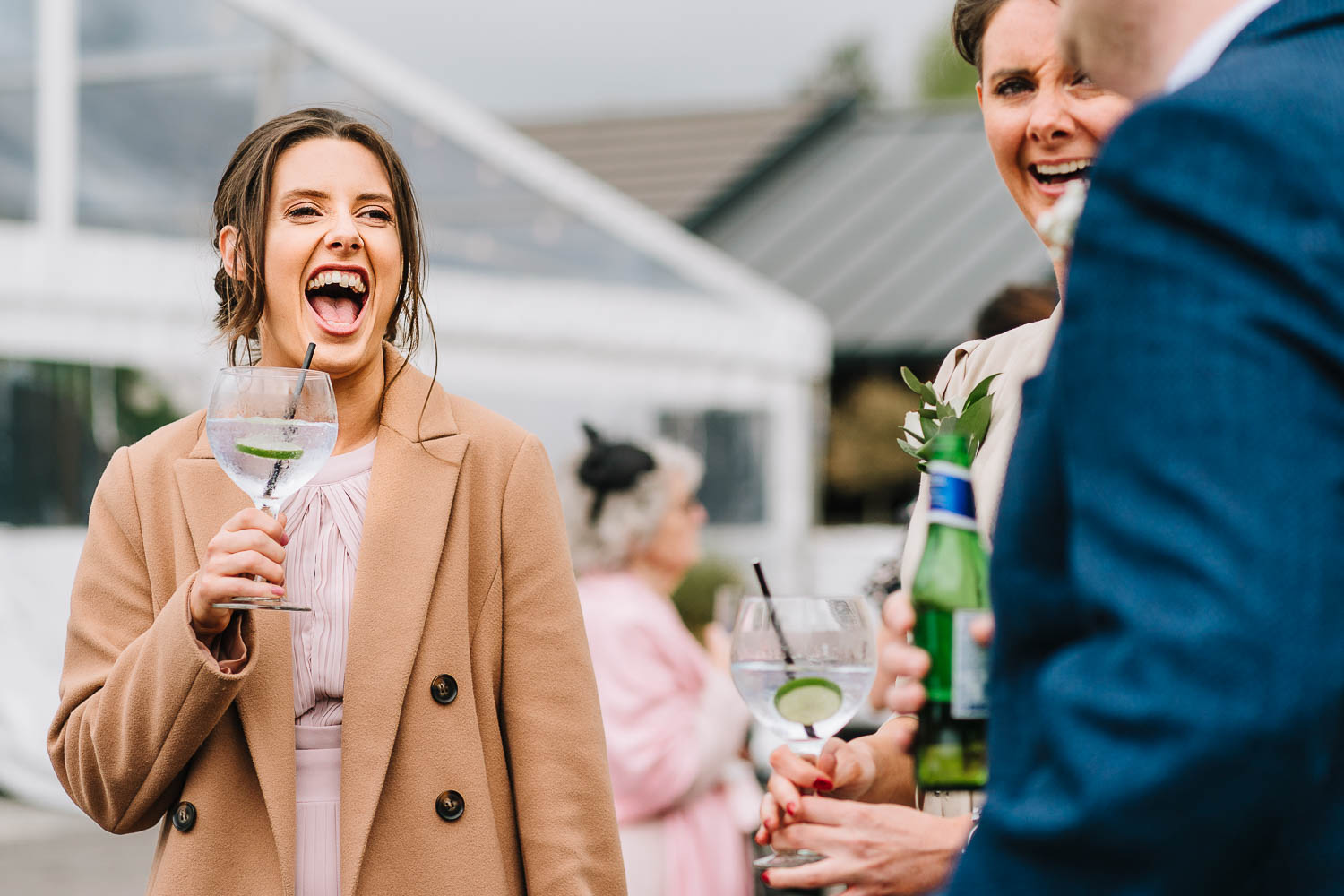 Wedding guest laughing