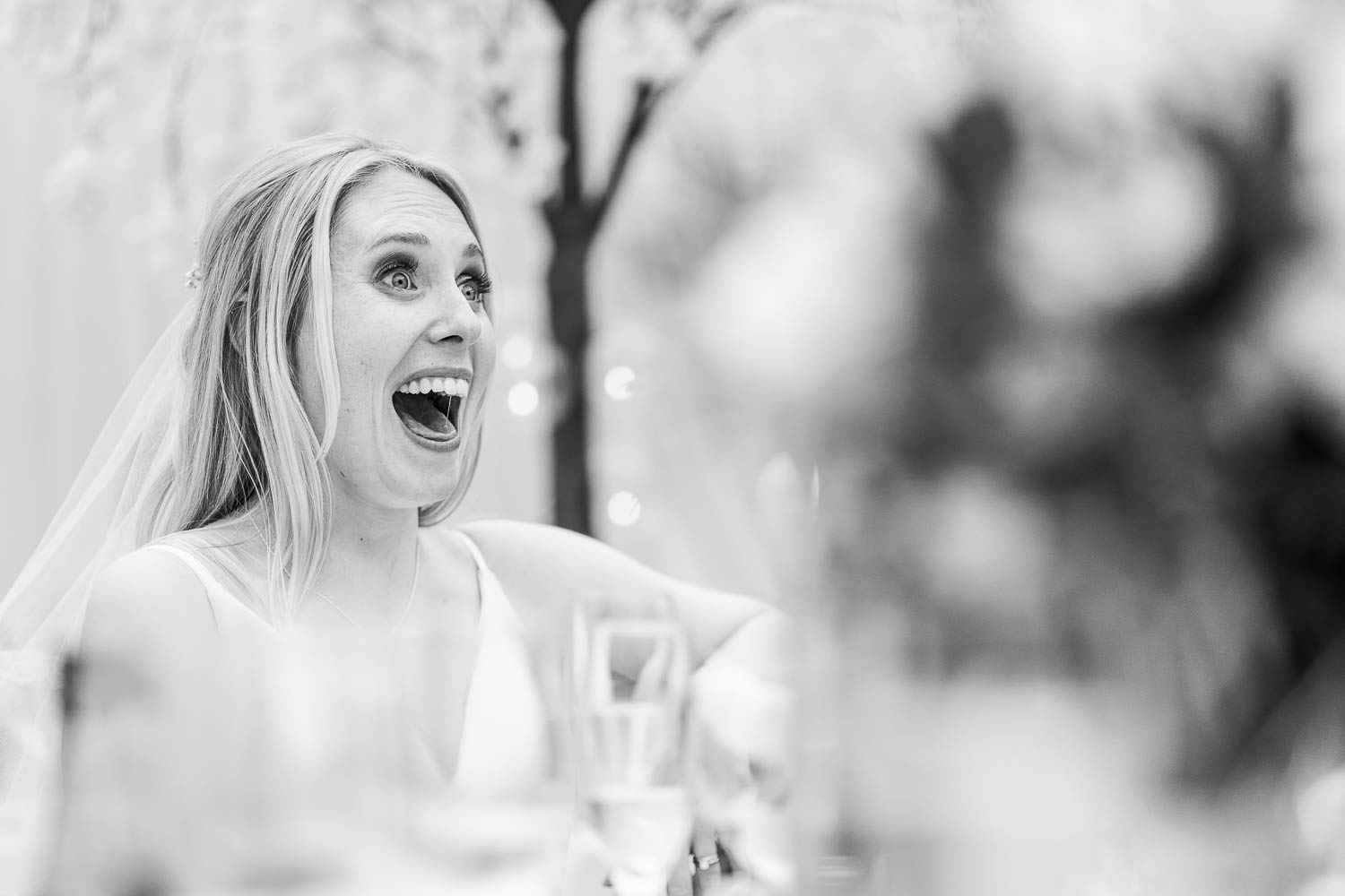 Bride smiling during speeches