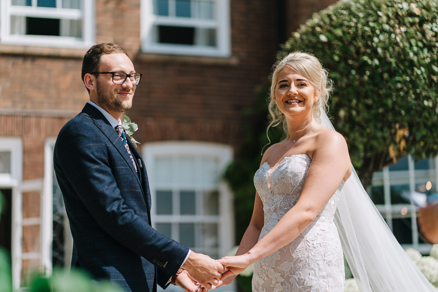 Bride and groom saying vows at Delamere Manor