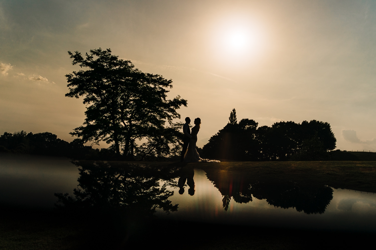 Photo of the bride and groom in the gardens of Delamere Manor