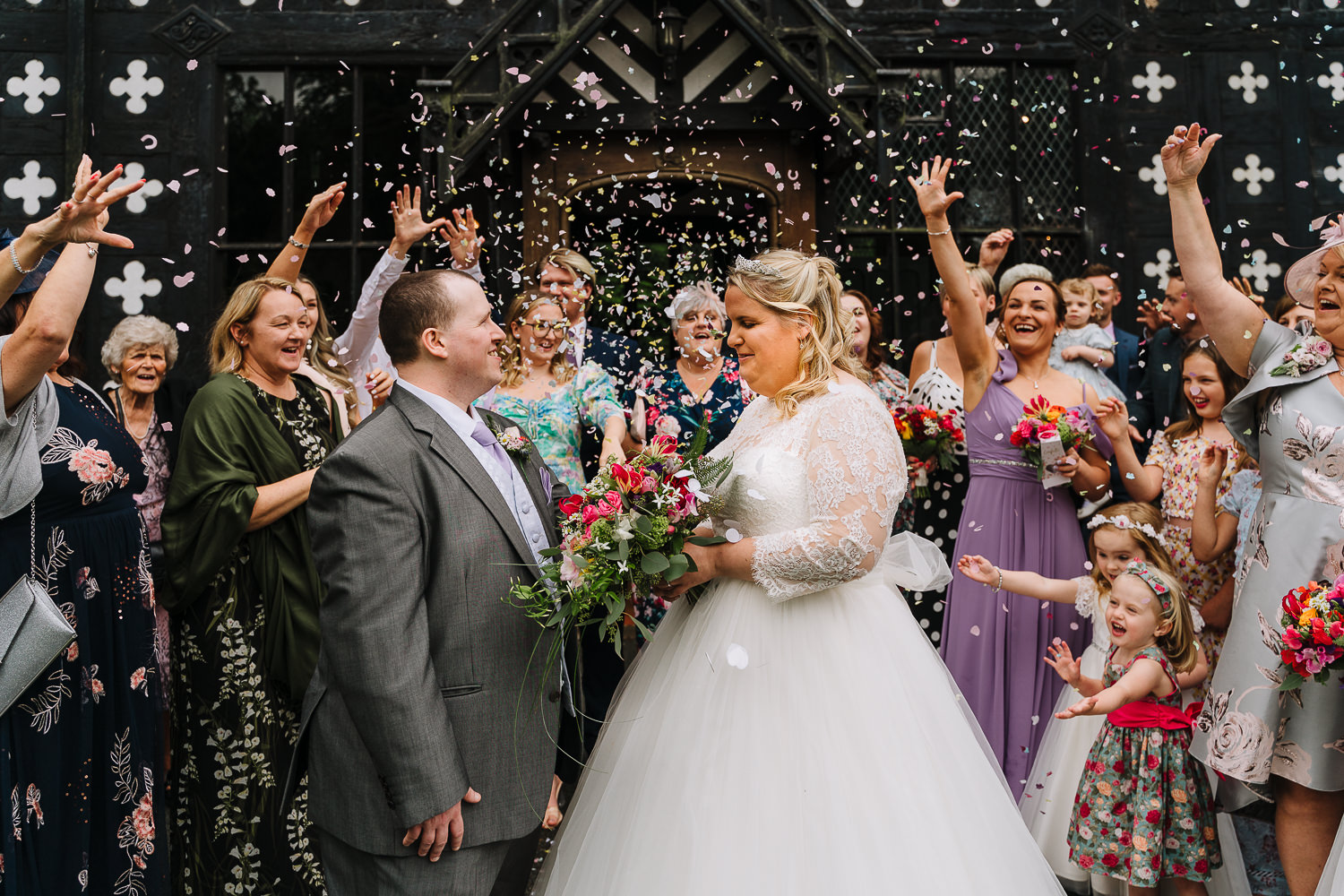 Samlesbury Hall Wedding Photography 11 bride and groom confetti photo at Samlesbury Hall